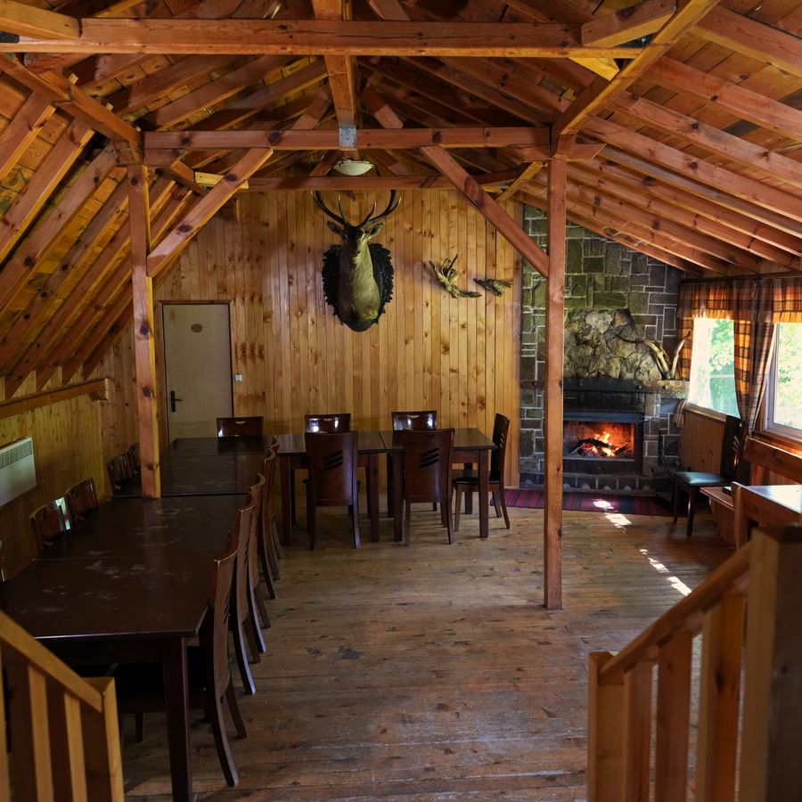 The dining hall with its stone fireplace